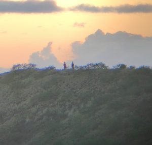 two hikers near sunset