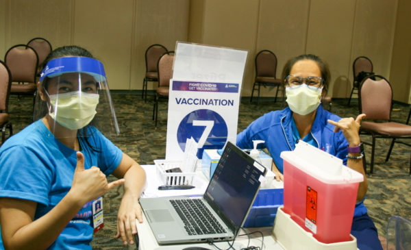 Nurses shaka at vaccination clinic