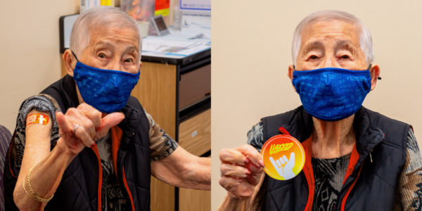 elderly woman vaccinated and sharing a shaka