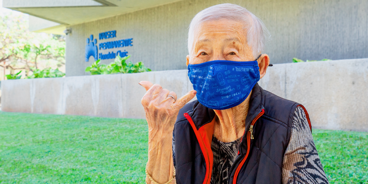 elderly woman outside a COVID-19 vaccination clinic